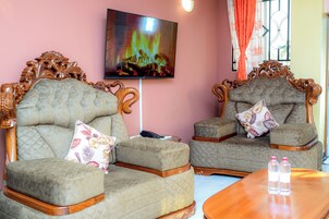 Suite de lujo, balcón | Zona de estar