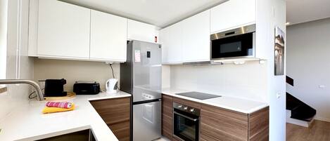 Microwave, coffee/tea maker, cookware/dishes/utensils