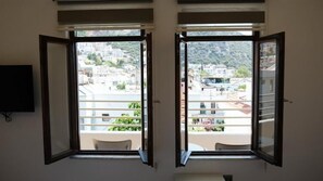 Deluxe Triple Room, Balcony, Partial Sea View | Balcony view