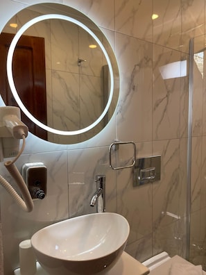 Shower, hair dryer, slippers, towels