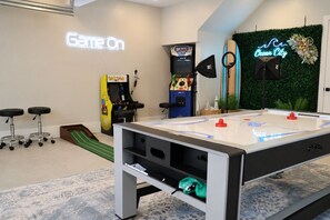 A room with a foosball table, arcade games, and a pool table. - Coastal Resort; Arcade, Pools, Pet-Friendly, Gym (Berlin)