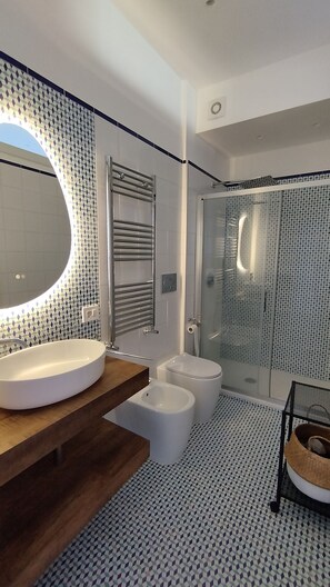 Hair dryer, bidet, towels, soap