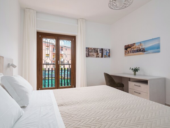 Comfort Apartment, Balcony, City View | Down comforters, desk, laptop workspace, blackout drapes