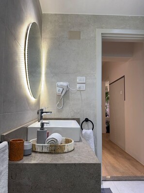 Hair dryer, bidet, towels, soap