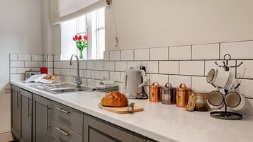Fridge, microwave, oven, cookware/dishes/utensils