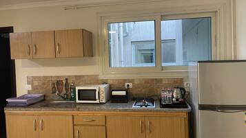 Habitación individual estándar, vista a la ciudad | Cocina privada