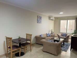 Appartement Deluxe, vue sur la ville | Aire de séjour