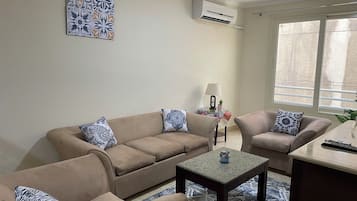 Apartamento Deluxe, vistas a la ciudad | Zona de estar