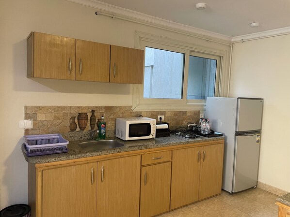 Habitación individual estándar, vistas a la ciudad | Cocina privada