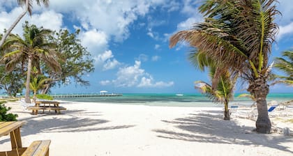 Hello Sunshine! Beachfront 2BR 2BA condo Retreat Rum Point w/ GYM, Tennis, &WiFi