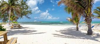 Hello Sunshine! Beachfront 2BR 2BA condo Retreat Rum Point w/ GYM, Tennis, &WiFi