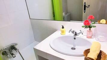 Hair dryer, towels, soap, shampoo