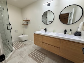 Shower, towels, soap, toilet paper