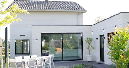 Charming family home, situated in a green setting with outside sauna.