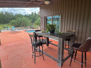 Outdoor dining - Once Upon Our Farm is a 3 bed/2 bath country pool home. Relaxation? Book Now! (Silver Springs)