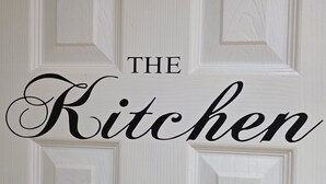 A white door with the words "THE Kitchen" in black lettering. - Spacious 3 Bed 2 Baths Free WiFi Central Location (MIDDLESBROUGH)
