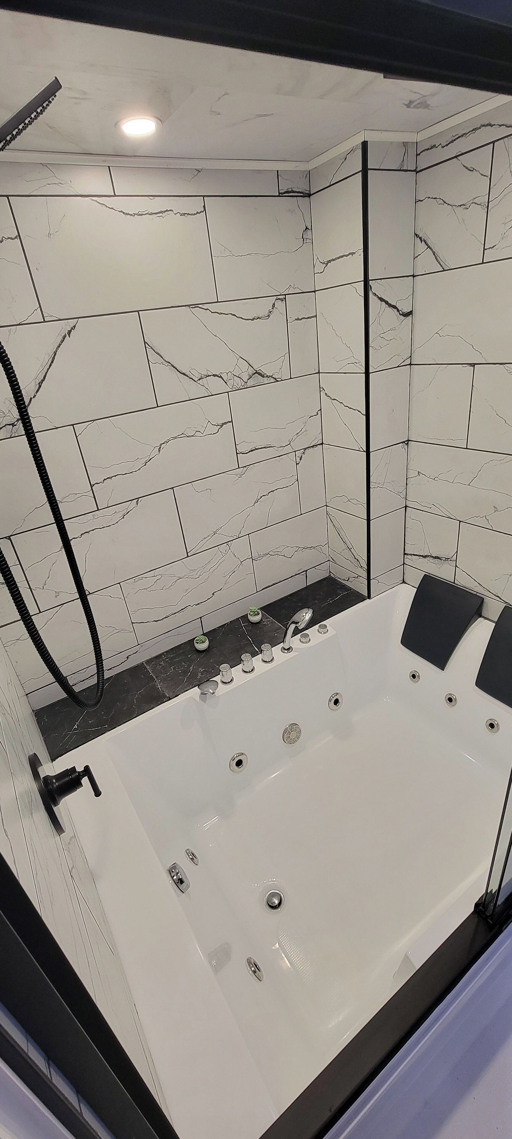 Jetted tub, towels, toilet paper