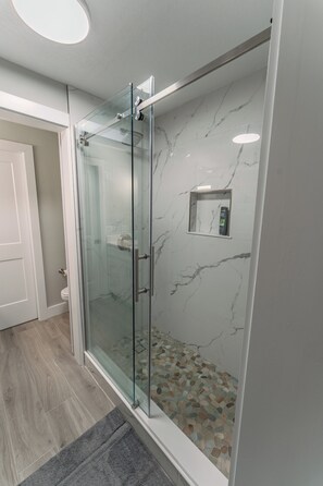 Shower, hair dryer, towels, soap