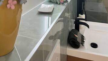 Shower, hair dryer, towels, soap