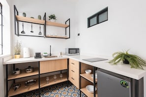 Fridge, microwave, coffee/tea maker, toaster