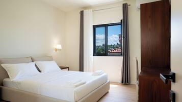 Deluxe Villa, Balcony, Beach View | In-room safe, blackout drapes, soundproofing, iron/ironing board