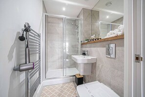 Shower, hair dryer, towels, soap