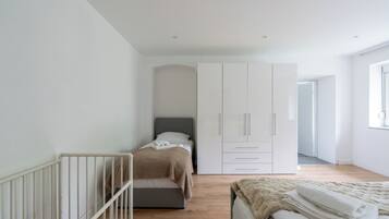Family Apartment, Multiple Beds, Pets Allowed, Garden View | Premium bedding, individually decorated, individually furnished, desk