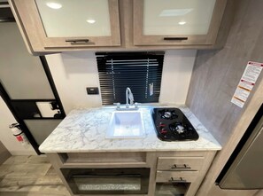 Fridge, microwave, stovetop, coffee/tea maker