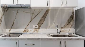 Fridge, stovetop, cookware/dishes/utensils, dining tables