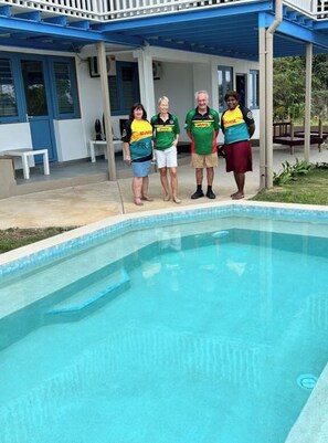 A swimming pool with a covered patio area. - Vila Backpackers  (Port Vila)