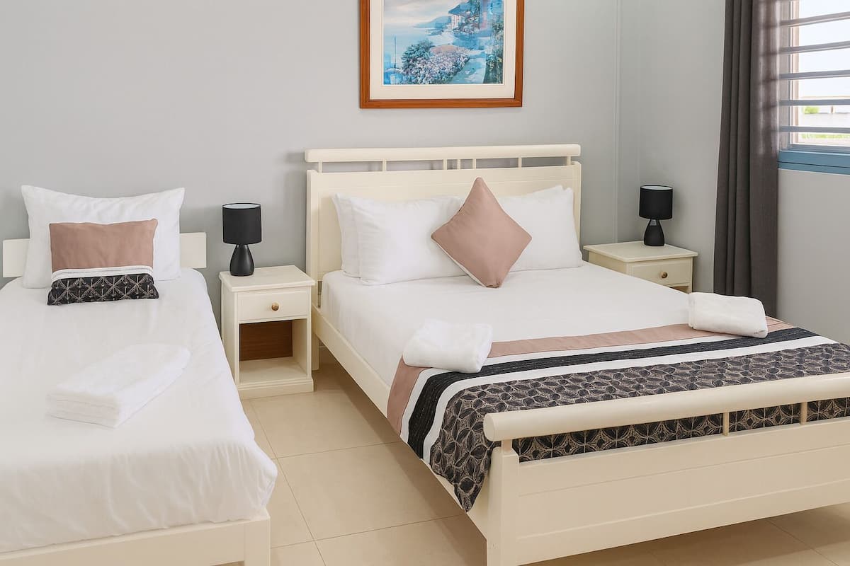 Triple Room, Mountain View | Blackout drapes, iron/ironing board, free WiFi