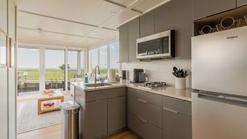 Fridge, microwave, stovetop, coffee/tea maker
