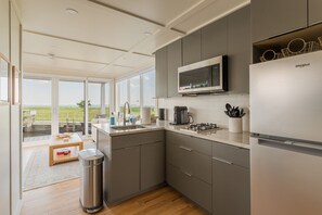 Fridge, microwave, stovetop, coffee/tea maker