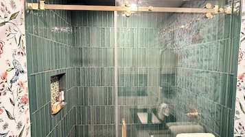 Shower, hair dryer, towels, soap