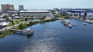 A marina with boats docked, a pier, and buildings labeled 'Pirates Cove' and 'Treasure Island Marina.'