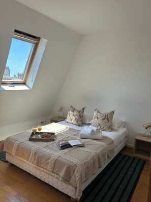 1 bedroom, desk, iron/ironing board, travel crib