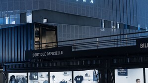 The exterior of the LdLC Arena with a prominent sign. - Studio Near LDLC ARENA OL (Décines-Charpieu)
