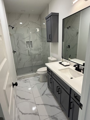 Shower, hair dryer, towels, soap