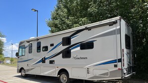 A Coachmen RV parked in a fire lane. - Spacious RV in Brilliant Broken Bow with AC, WiFi, near Day Spa and Winery! (Broken Bow)