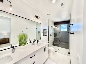 Shower, hair dryer, towels, shampoo