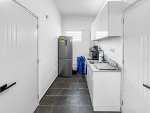 Fridge, microwave, stovetop, coffee/tea maker