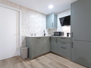 Fridge, coffee/tea maker, toaster, cookware/dishes/utensils