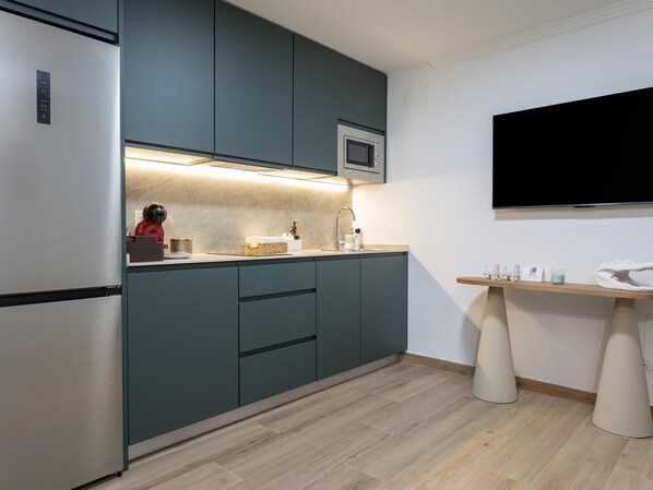 Fridge, microwave, coffee/tea maker, toaster