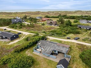 A coastal property with multiple houses, a large open lawn, and a view of the sea. - "Claudine" - 700m from the sea by Interhome (Thisted)