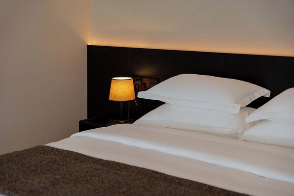 Luxury Suite, Courtyard View | Premium bedding, down duvets, free minibar, individually decorated
