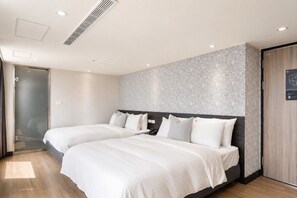 A hotel room with two beds, a modern design, and a view of the city. - ElEnce Hotel (Taichung)