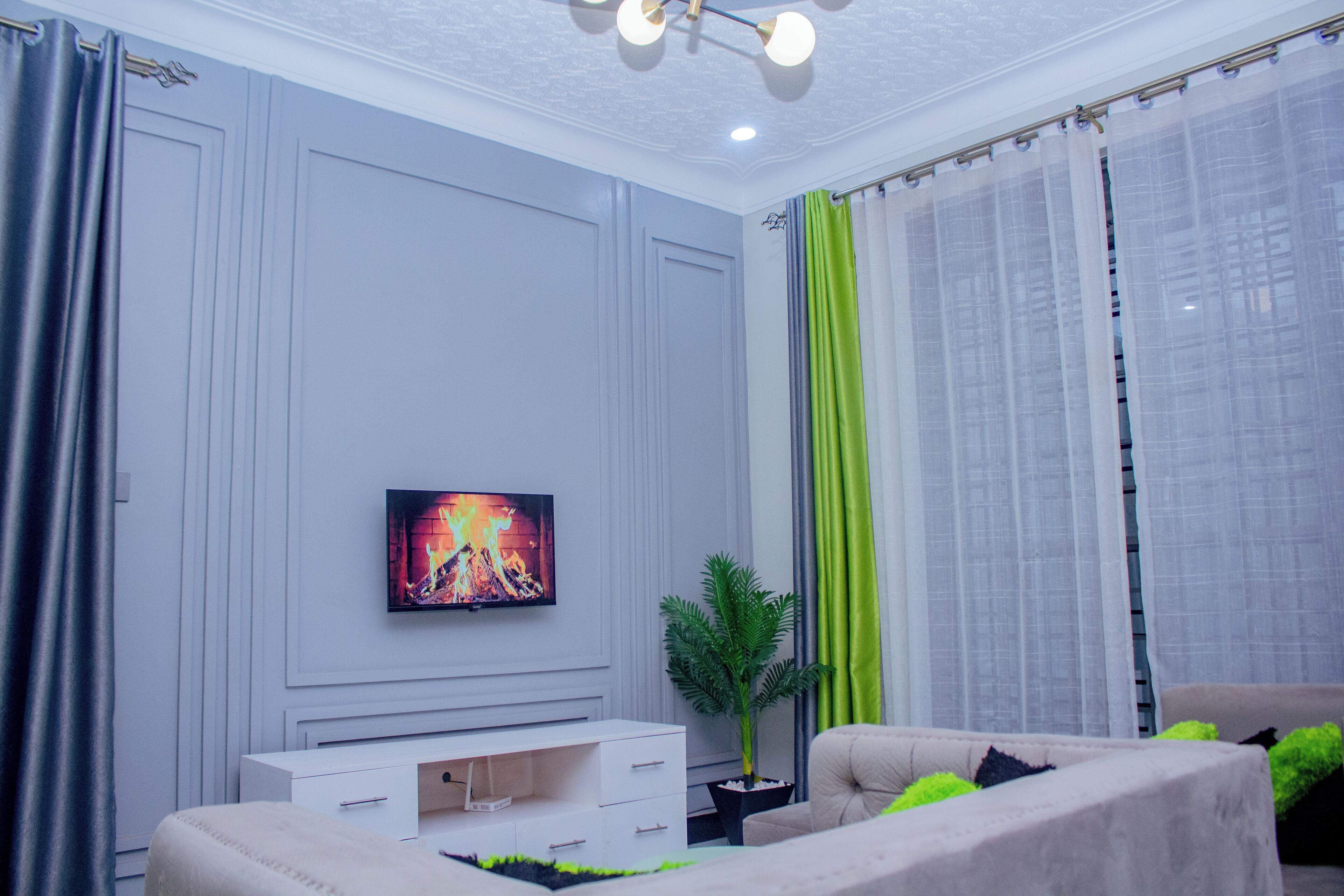 Apartment, Garden View | Living area | Flat-screen TV