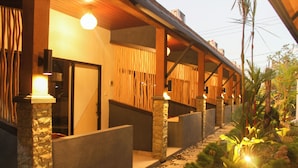 A corridor with stone walls, wooden beams, and a pathway leading to a door. - The Kantun Ungasan (Ungasan)