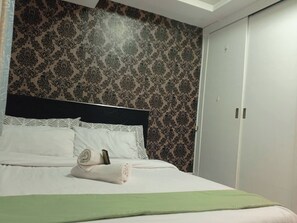 1 bedroom, iron/ironing board, internet - Grand Riviera Condotel Near St lukes Medical Center (Manila)