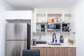 Fridge, microwave, stovetop, coffee/tea maker